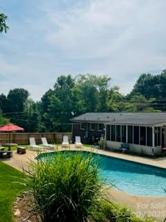 3001 Beaty Road Gastonia, NC 28056 - Photo 3 of 15 a view of a house with swimming pool and garden