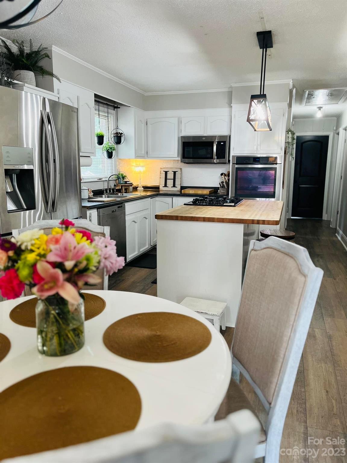 3001 Beaty Road Gastonia, NC 28056 - Photo 6 of 15 a kitchen with sink a stove and chairs