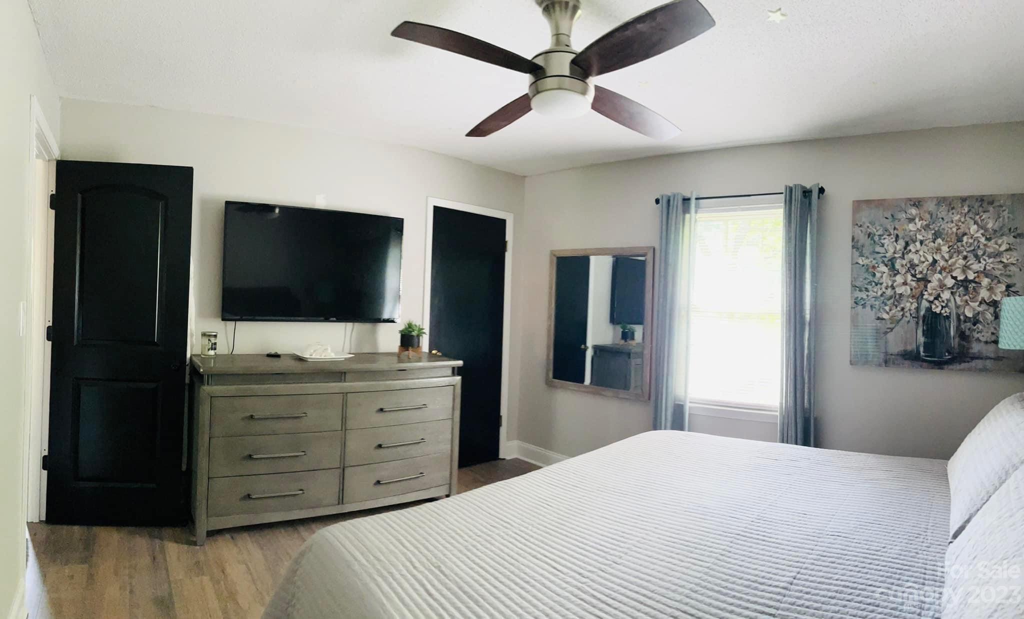 3001 Beaty Road Gastonia, NC 28056 - Photo 7 of 15 a bedroom with a bed and a flat screen tv