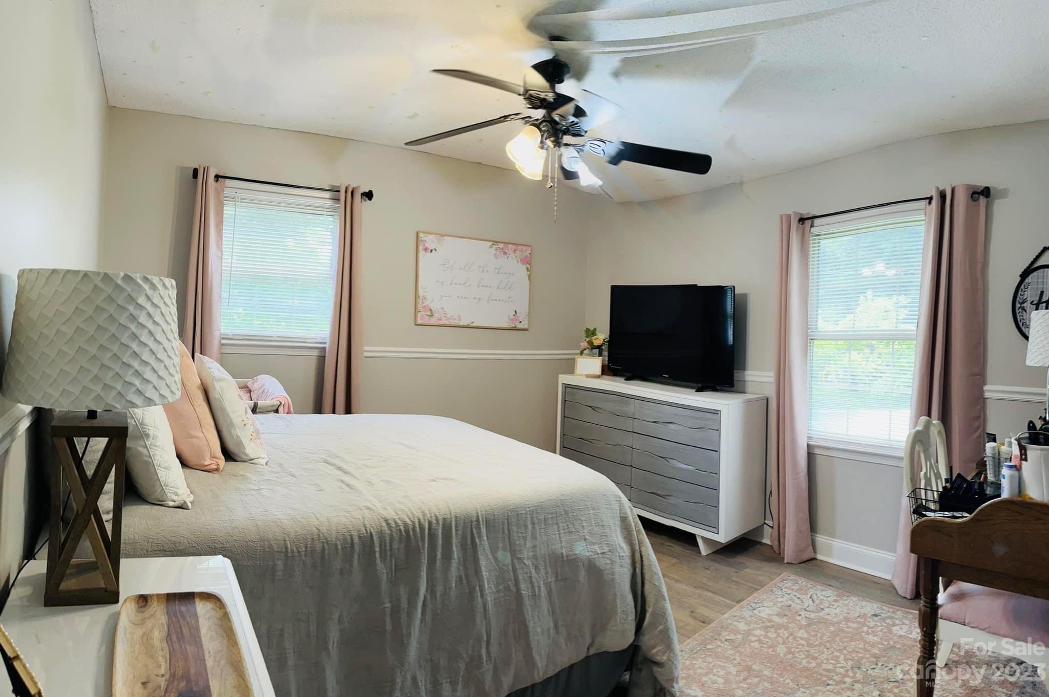 3001 Beaty Road Gastonia, NC 28056 - Photo 10 of 15 a bedroom with a bed and a flat screen tv