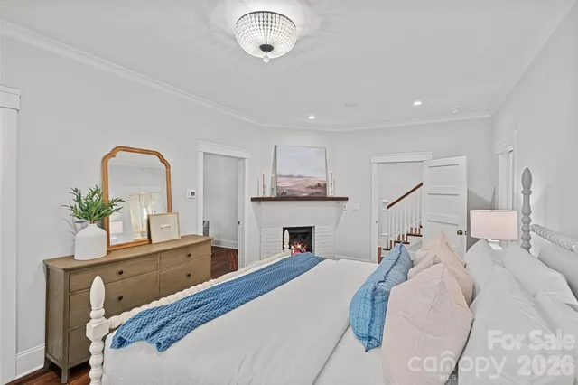 a bed room with a bed and a potted plant