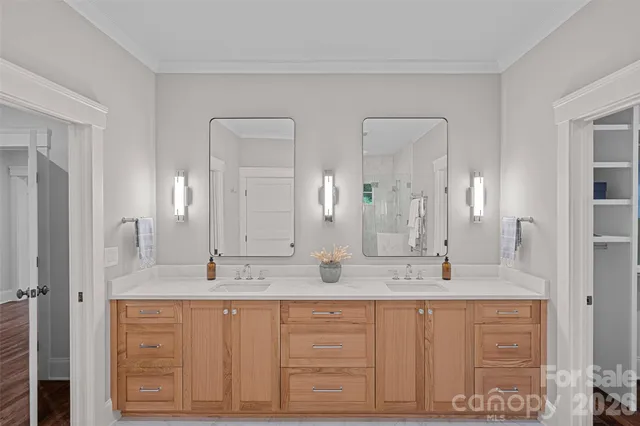 a bathroom with a granite countertop sink mirror and double