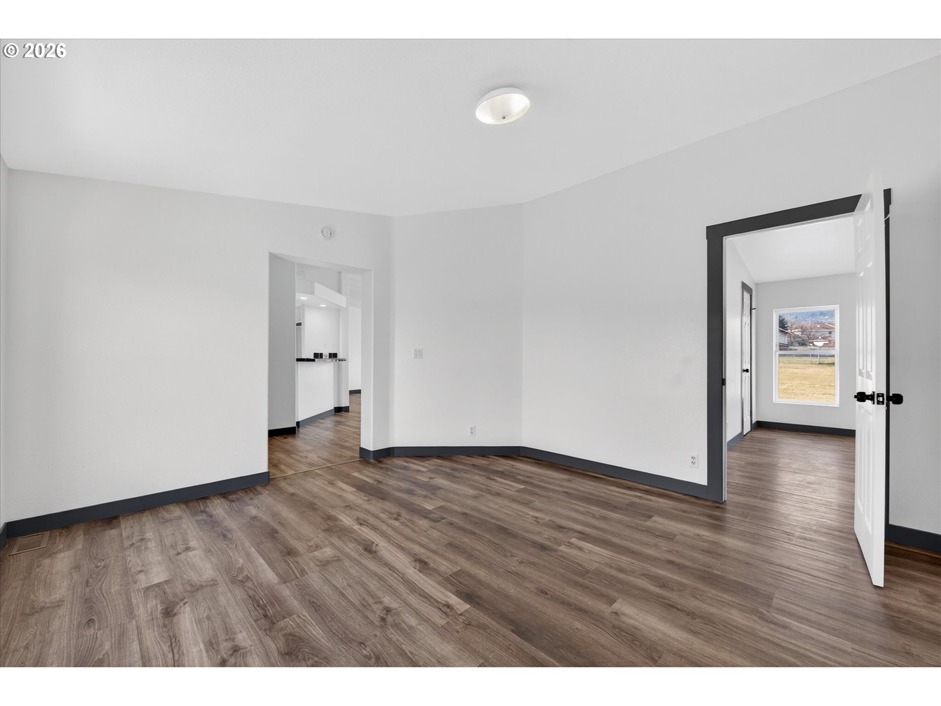208 16th Street La Grande, OR 97850 - Photo 17 of 42 a view of an empty room and wooden floor