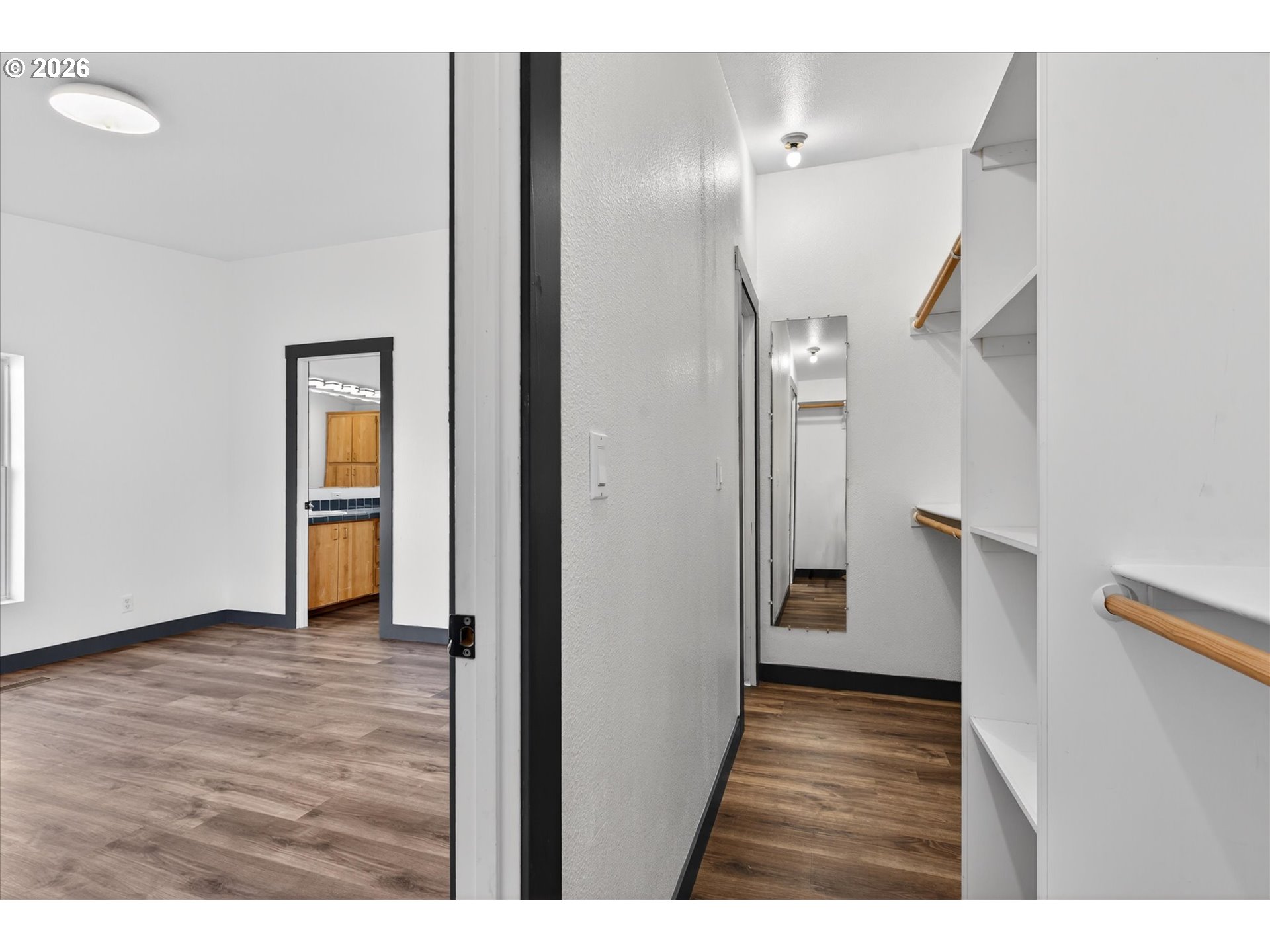 208 16th Street La Grande, OR 97850 - Photo 20 of 42 a view of hallway with stairs and wooden floor