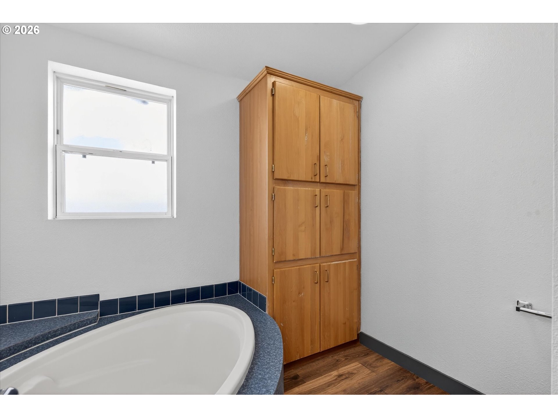 208 16th Street La Grande, OR 97850 - Photo 22 of 42 a bathroom with a sink and a mirror