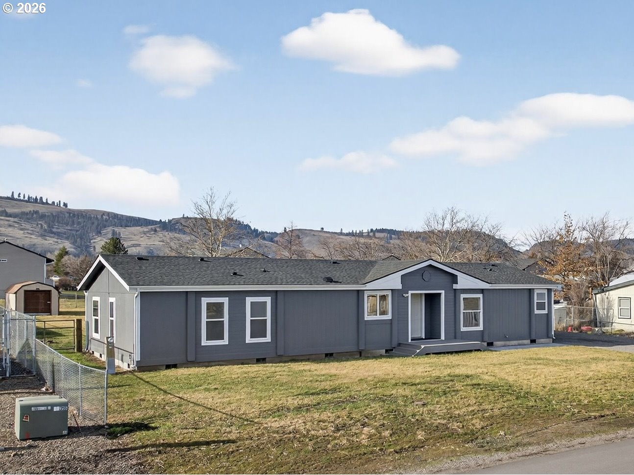 208 16th Street La Grande, OR 97850 - Photo 3 of 42 a front of a house with a yard