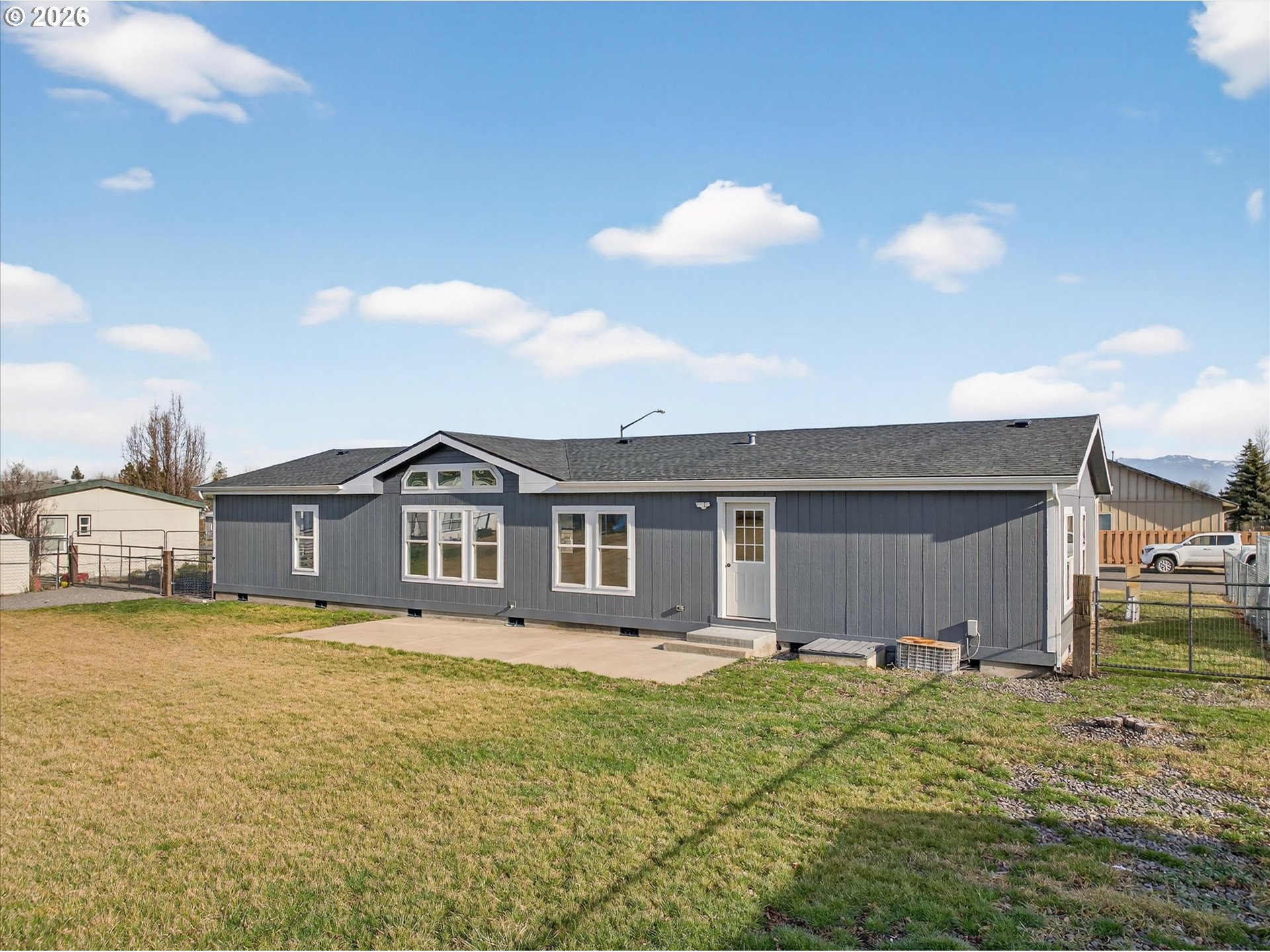 208 16th Street La Grande, OR 97850 - Photo 35 of 42 a front view of a house with a garden and yard