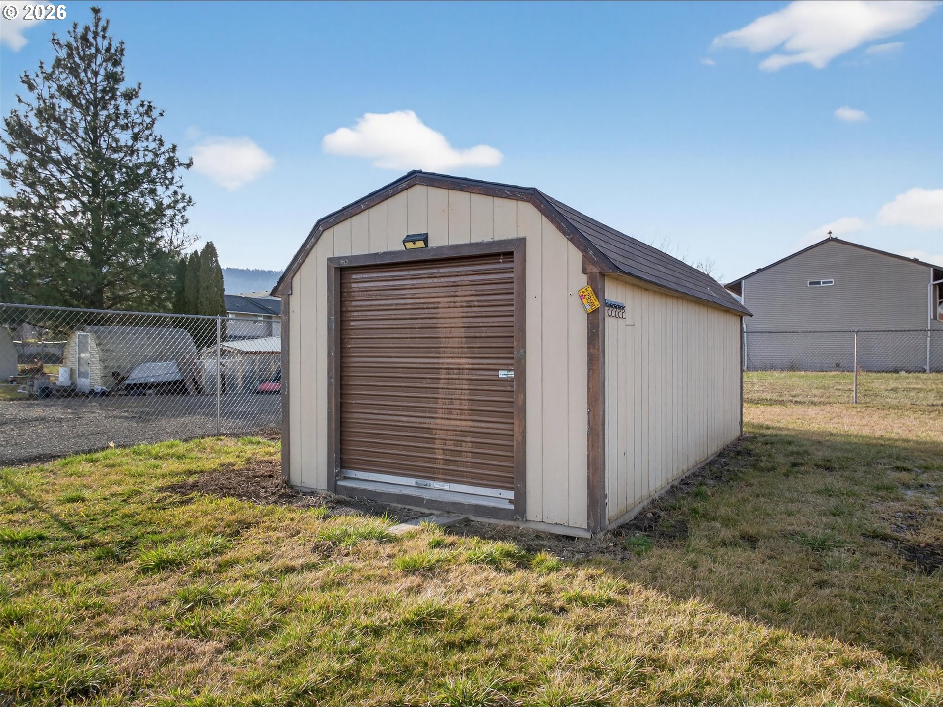 208 16th Street La Grande, OR 97850 - Photo 37 of 42 a view of a house with backyard and sitting area