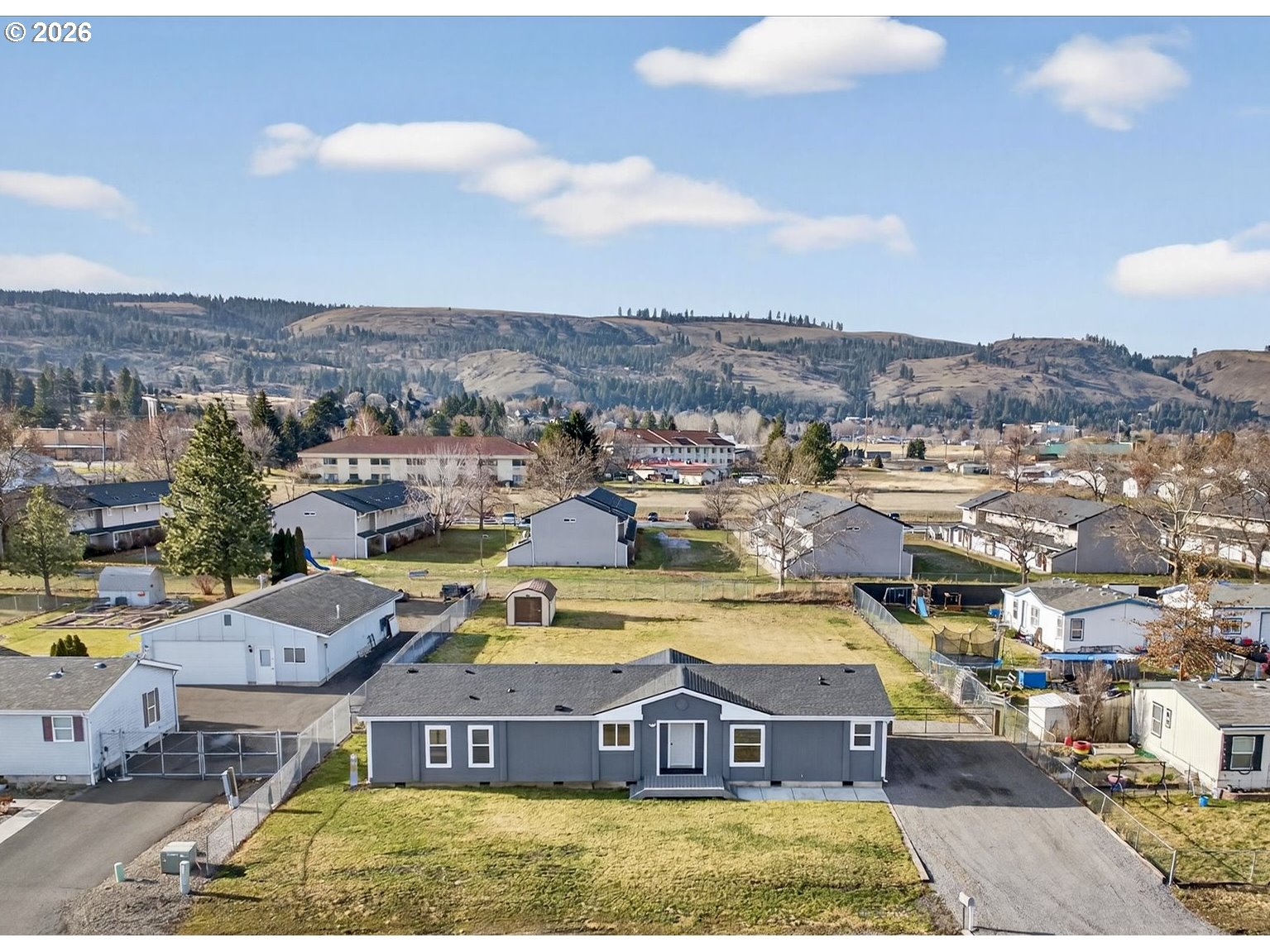 208 16th Street La Grande, OR 97850 - Photo 4 of 42 a view of a city with lawn chairs