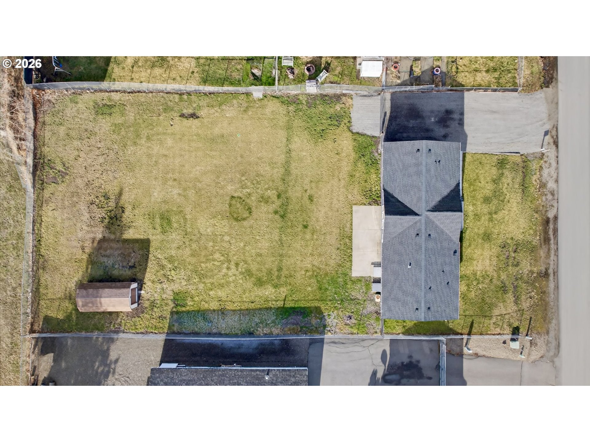 208 16th Street La Grande, OR 97850 - Photo 6 of 42 an aerial view of a house with a yard