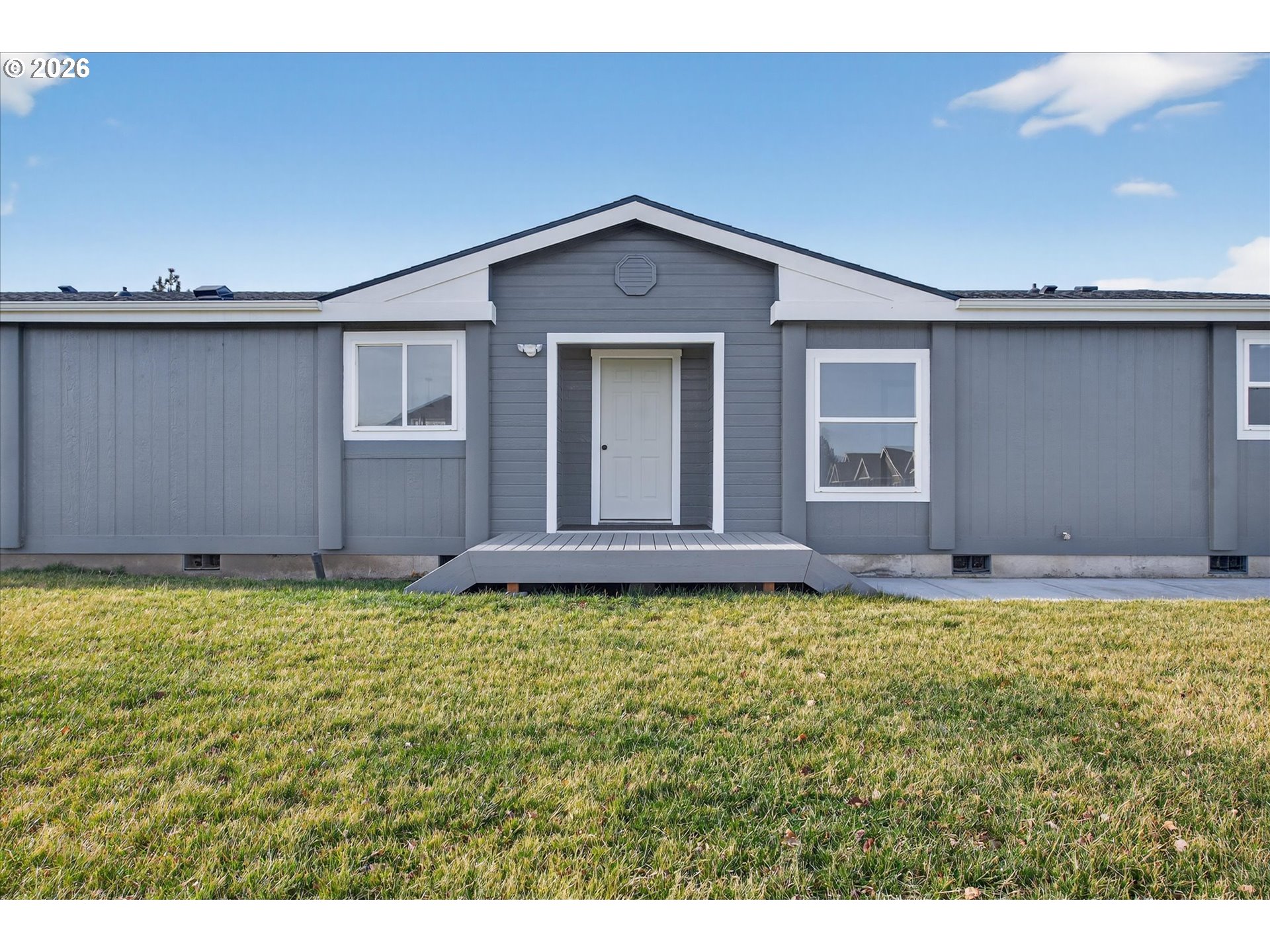 208 16th Street La Grande, OR 97850 - Photo 7 of 42 a view of a house with a yard