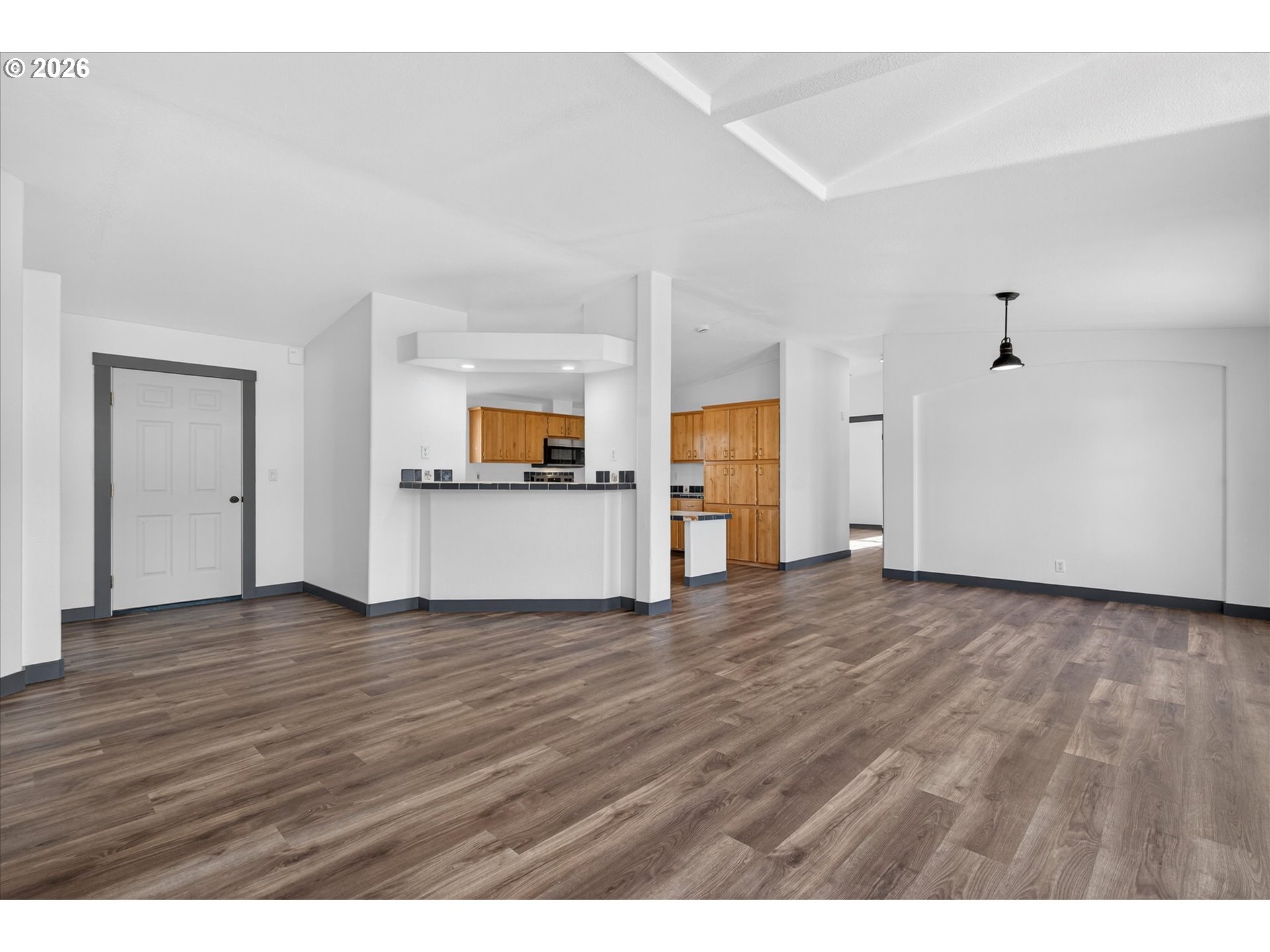 208 16th Street La Grande, OR 97850 - Photo 8 of 42 a view of empty room with wooden floor