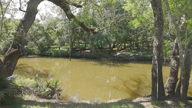 a dining room with furniture and a chandelier