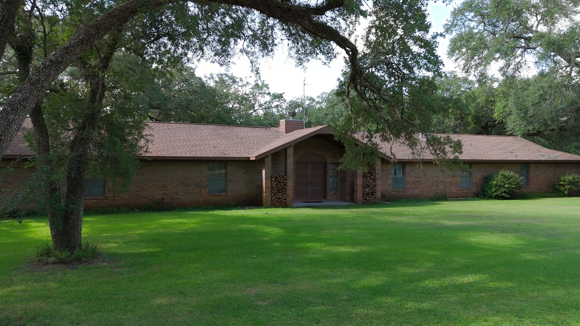 406 Wilson Creek Road Palacios, TX 77465 - Photo 16 of 49 a front view of a house with garden