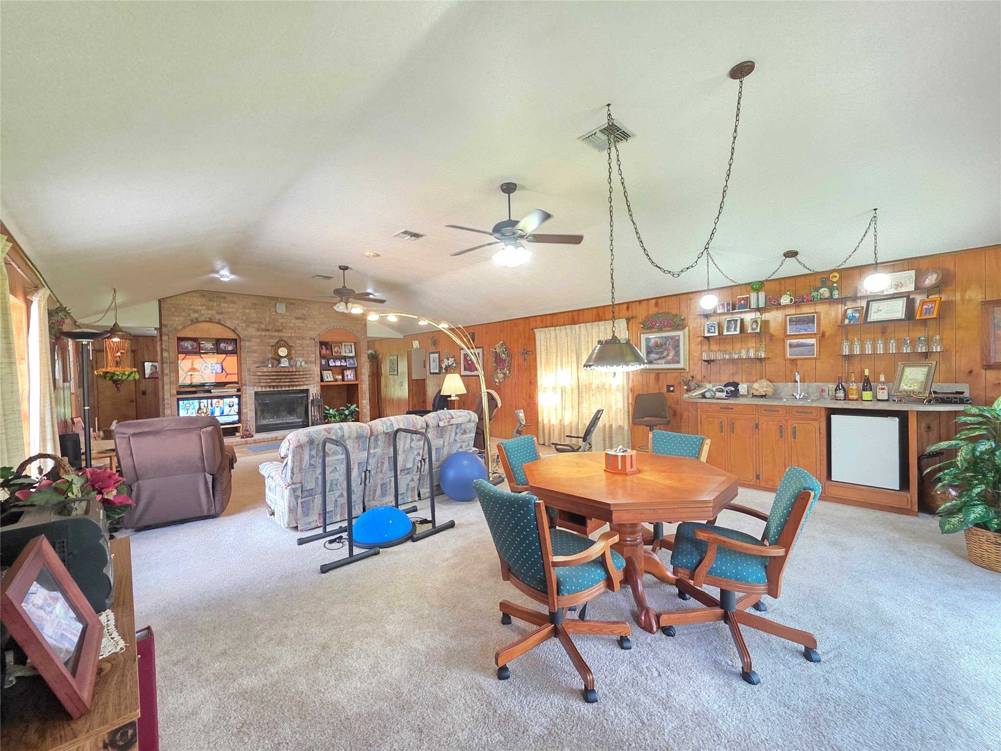 406 Wilson Creek Road Palacios, TX 77465 - Photo 20 of 49 a dining room with furniture and a chandelier