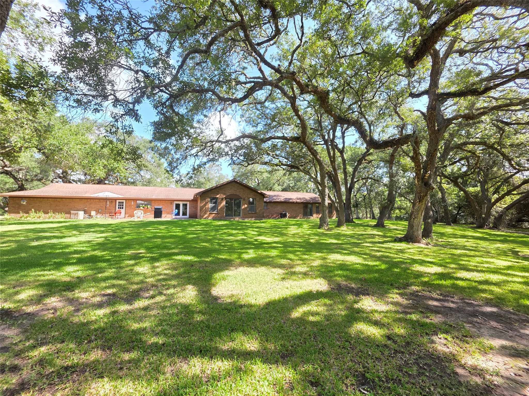 406 Wilson Creek Road Palacios, TX 77465 - Photo 2 of 49 a front view of a house with garden