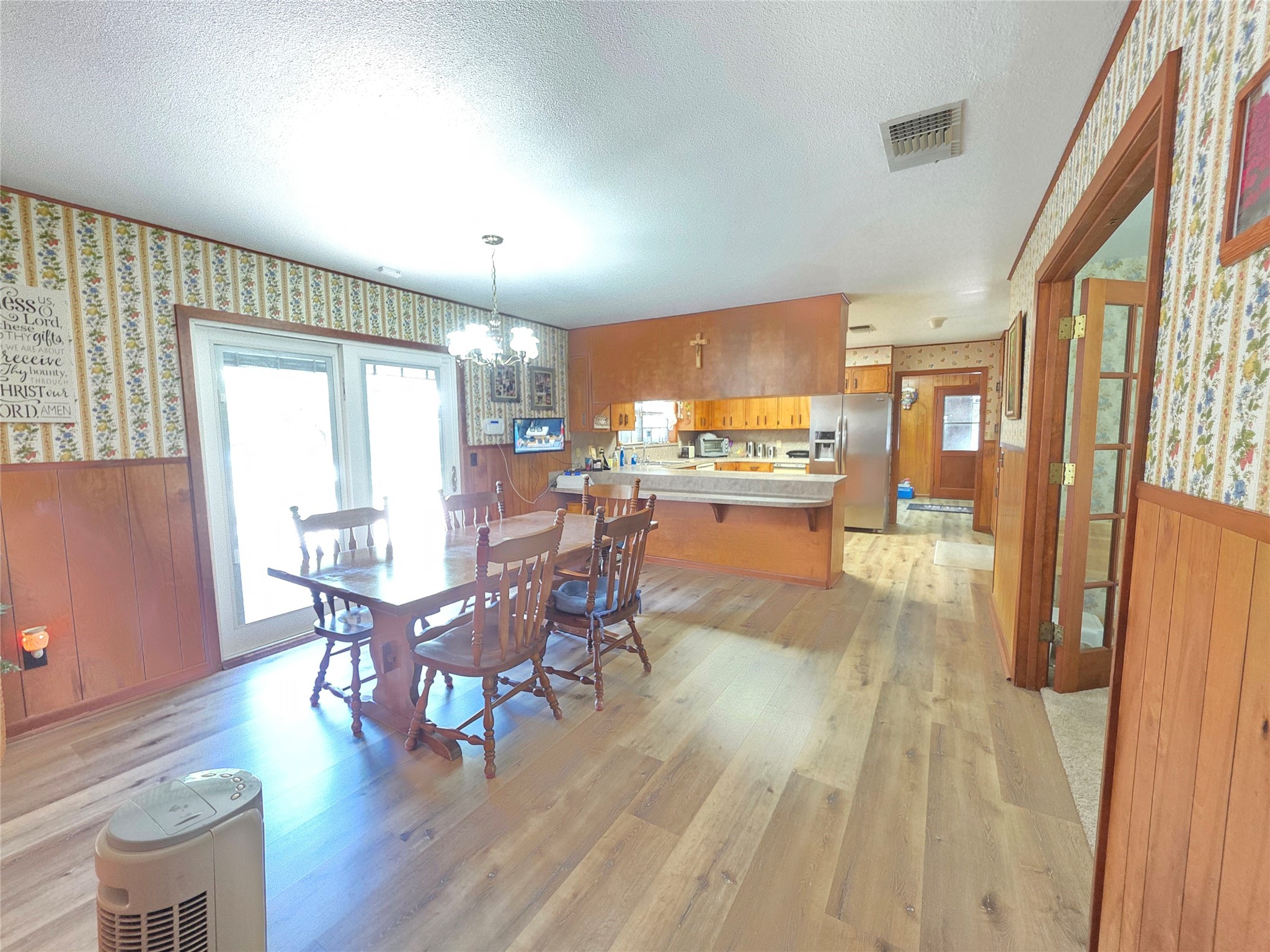 406 Wilson Creek Road Palacios, TX 77465 - Photo 34 of 49 a view of a dining room with furniture window and wooden floor