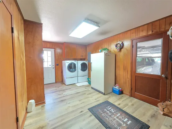 a refrigerator freezer sitting inside of a kitchen