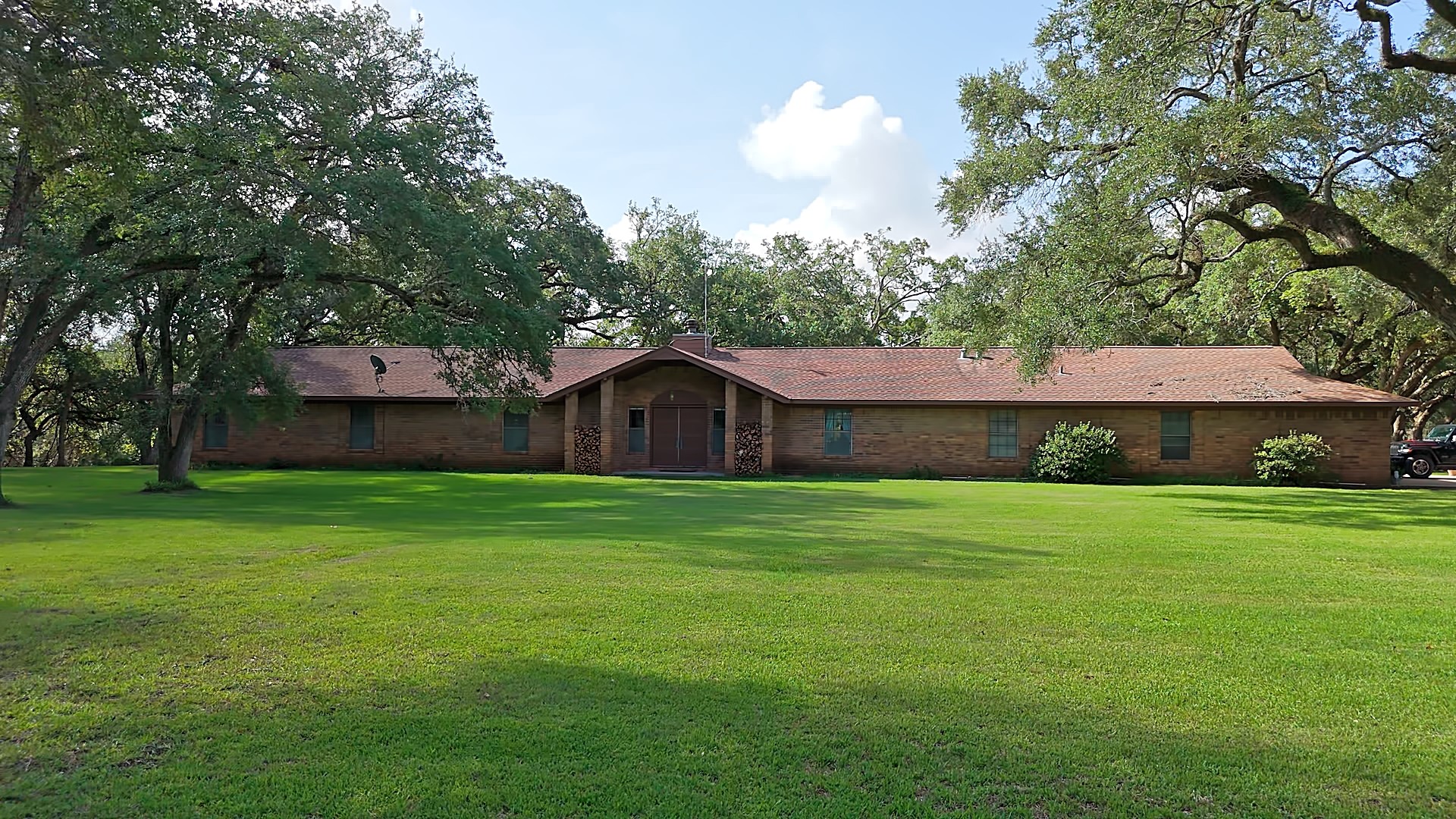 406 Wilson Creek Road Palacios, TX 77465 - Photo 5 of 49 a backyard of a house with wooden fence and a table and chairs