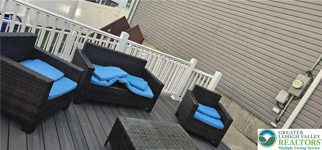 a living room with furniture or couch and a chandelier