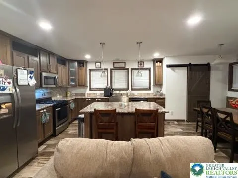 a view of a dining room with furniture and window