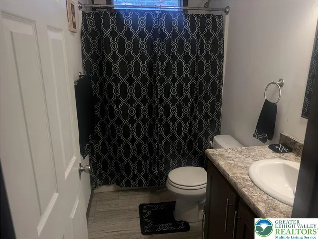a large bathroom with a sink and a large mirror