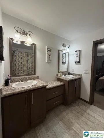 a bathroom with a toilet and shower
