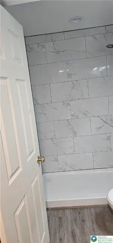 a bathroom with a toilet and a sink