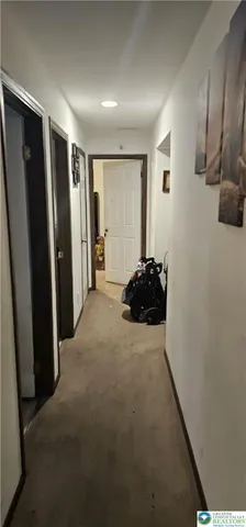 a view of a room with racks on the wall