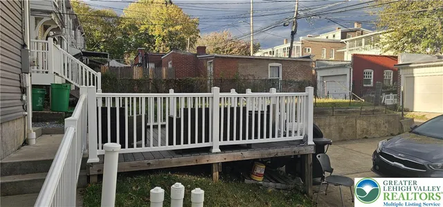 a view of a chair and table in the balcony