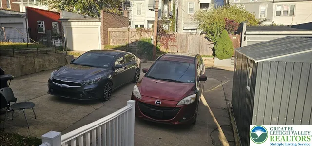 a view of a balcony with wooden fence