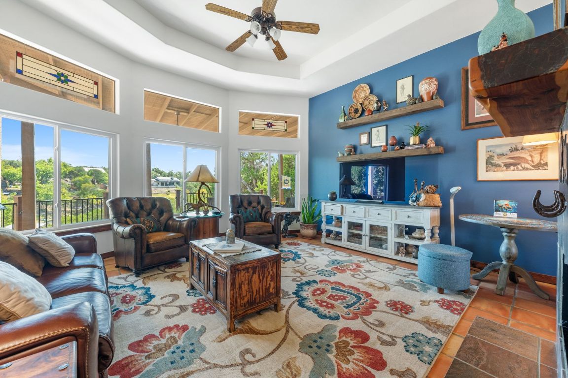 16312 Lake Loop Austin, TX 78734 - Photo 12 of 36 a living room with furniture a rug and a large window