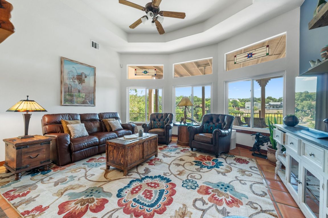 16312 Lake Loop Austin, TX 78734 - Photo 13 of 36 a living room with furniture and a large window