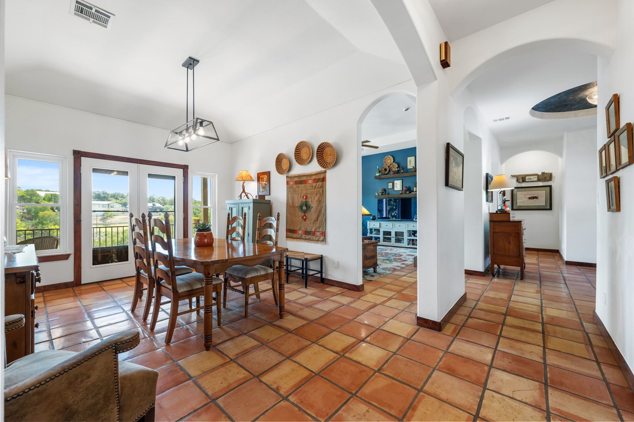 16312 Lake Loop Austin, TX 78734 - Photo 16 of 36 a view of a dining room with furniture window and wooden floor