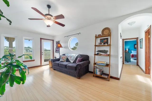 a living room with furniture and a large window