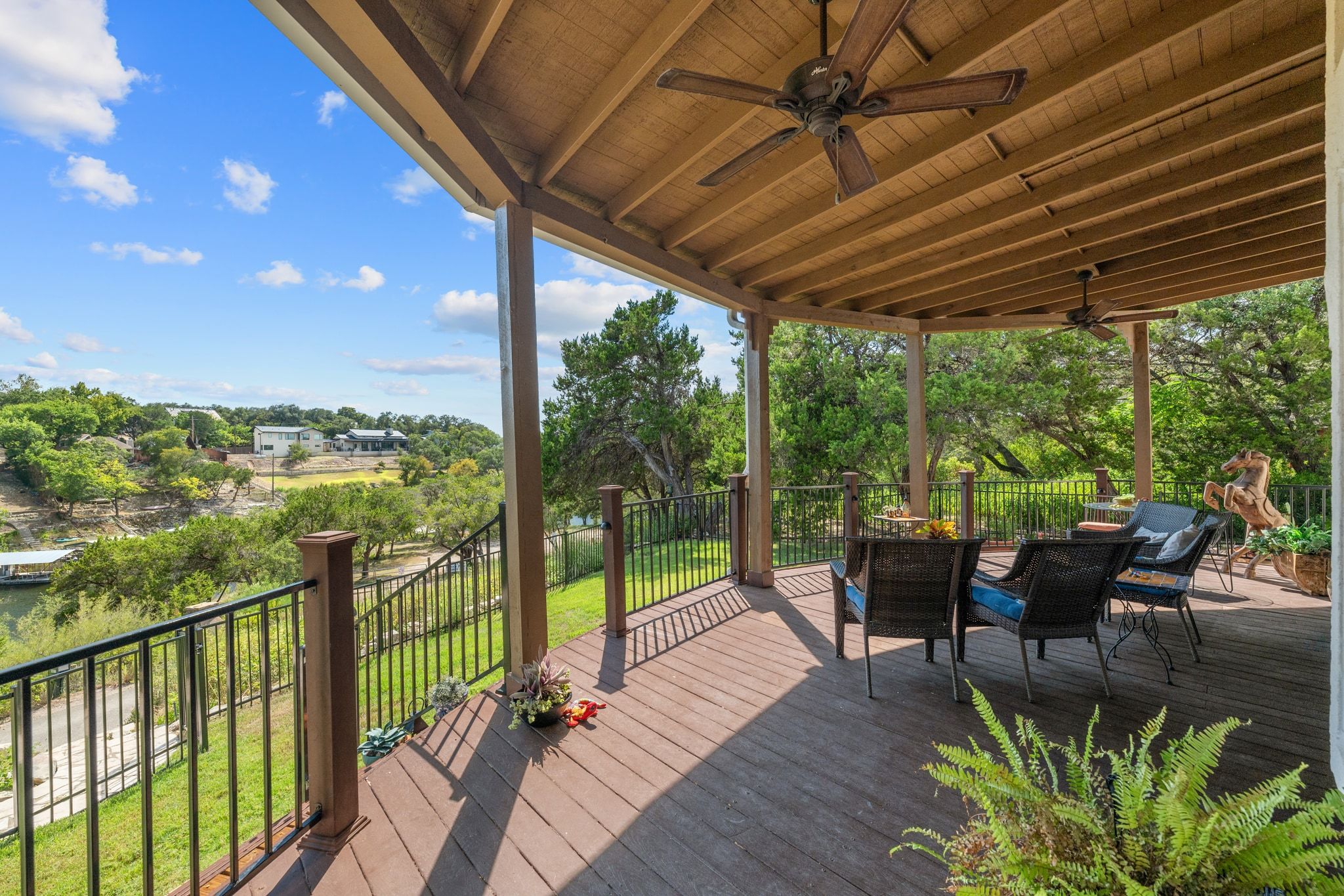 16312 Lake Loop Austin, TX 78734 - Photo 34 of 36 a view of a patio with chairs and wooden floor