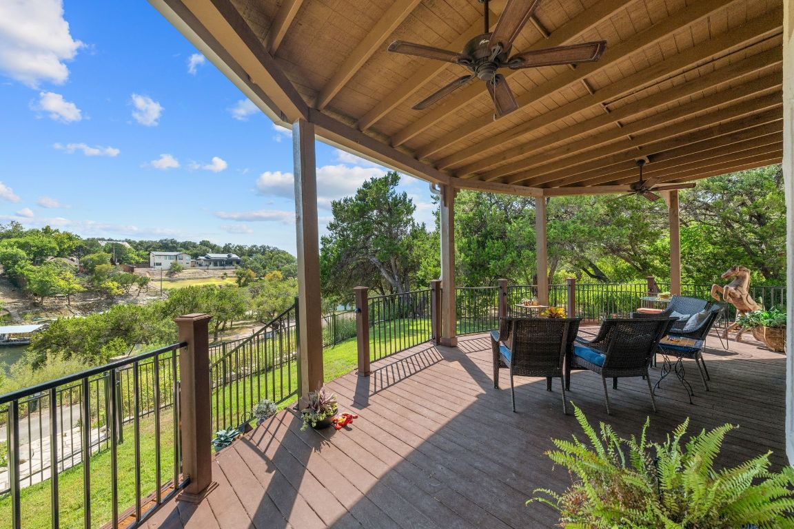 16312 Lake Loop Austin, TX 78734 - Photo 34 of 36 a view of a patio with chairs and wooden floor
