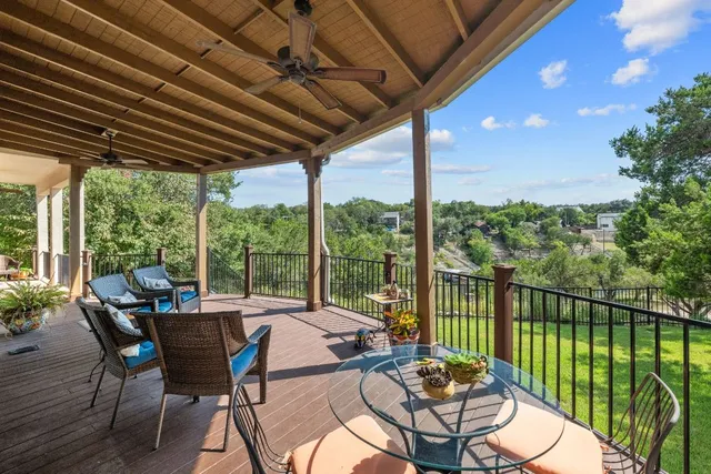 a view of a patio with a table chairs and a table