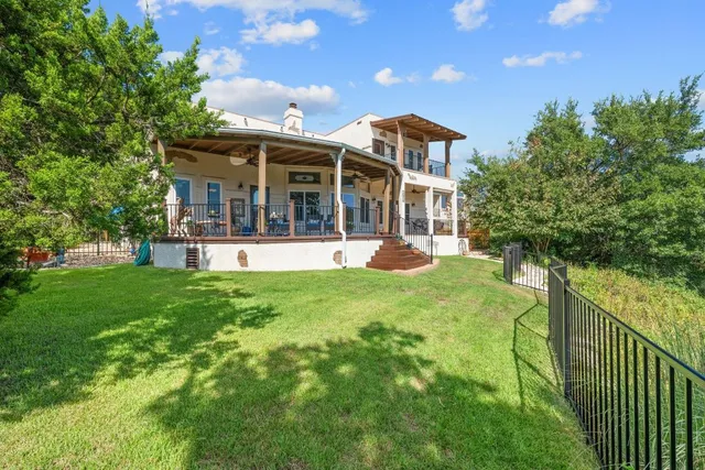a front view of a house with a yard table and chairs
