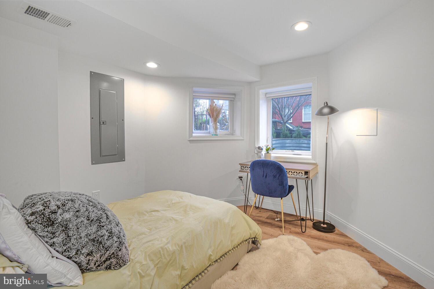 110 Seaton Place Northwest Washington, DC 20001 - Photo 24 of 47 a bedroom with a bed and chair