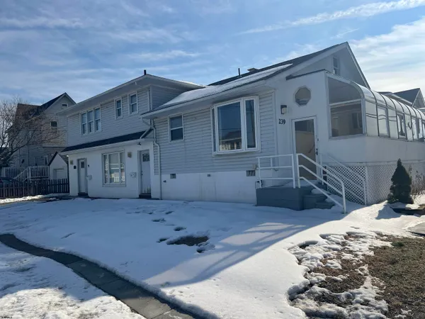 a view of a house with a snow