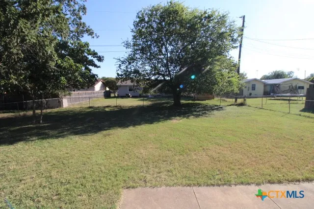 a view of a chairs and tables in patio