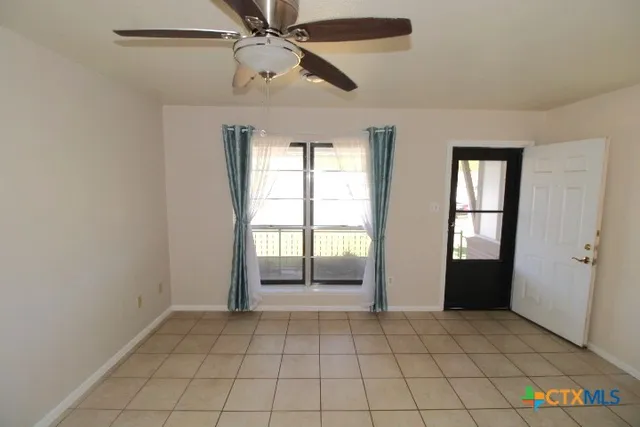 a view of an empty room and window