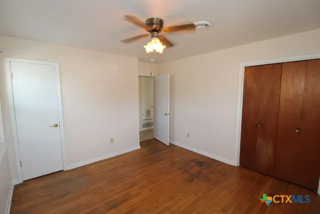 a bathroom with a sink toilet and window