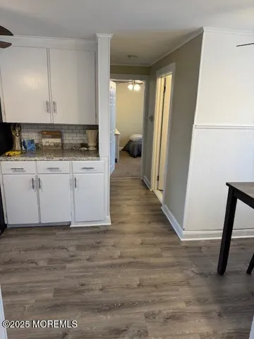 a view of a kitchen from the hallway