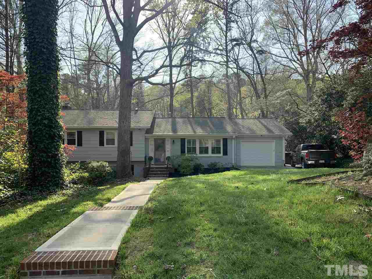 4931 Oak Park Road Raleigh, NC 27612 - Photo 1 of 10 a view of a house with a yard and pathway