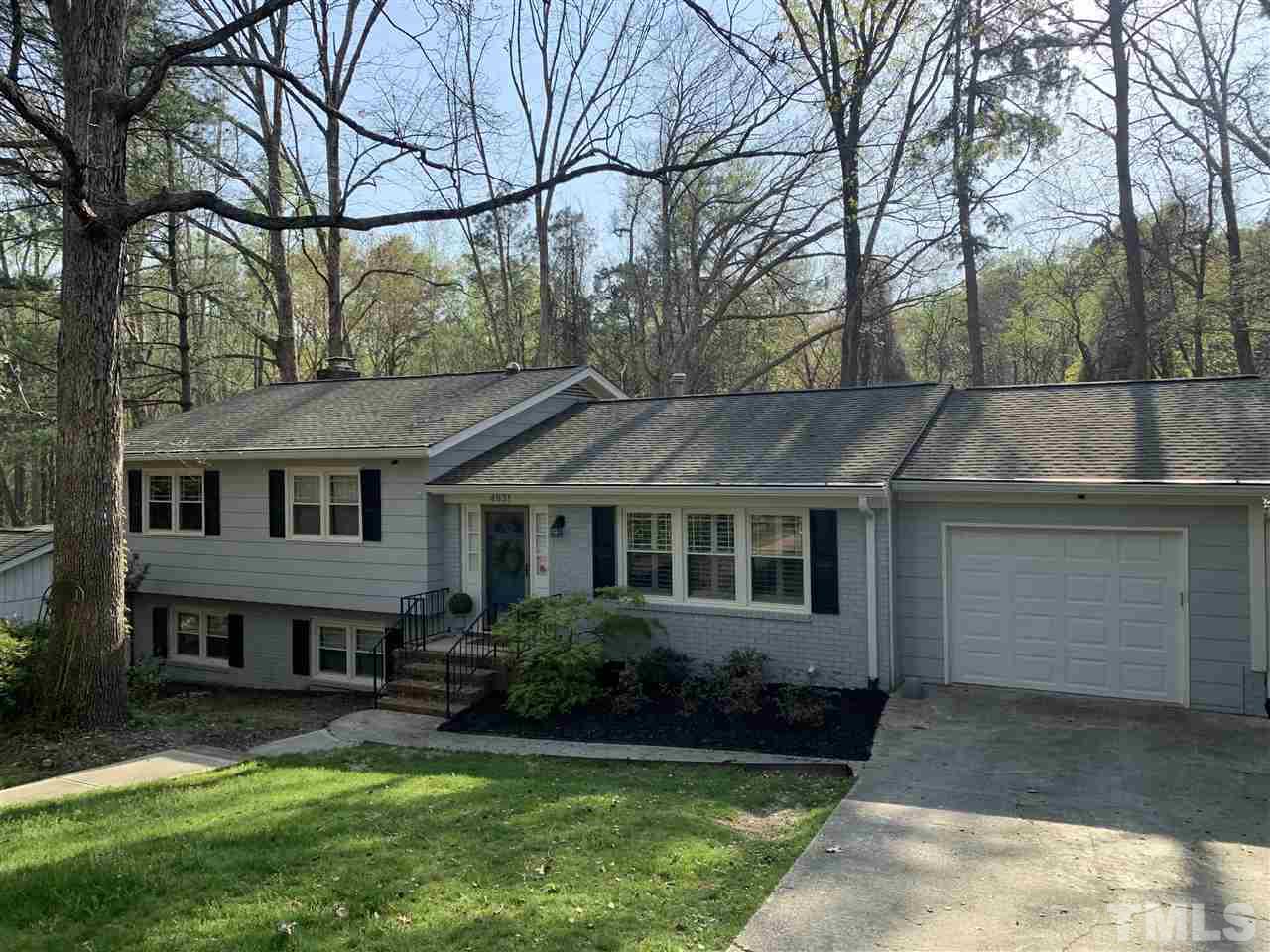 4931 Oak Park Road Raleigh, NC 27612 - Photo 2 of 10 front view of a house with a yard