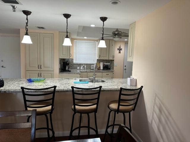 6500 Northwest 2nd Avenue, Unit 512 Boca Raton, FL 33487 - Photo 11 of 41 a kitchen with a table and chairs