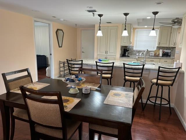 6500 Northwest 2nd Avenue, Unit 512 Boca Raton, FL 33487 - Photo 13 of 41 a view of a dining area with furniture and wooden floor