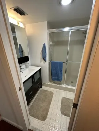 a white toilet sitting next to a bathroom sink